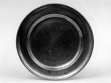William Horsewell. <em>Plate</em>, before 1705. Pewter, 5/8 x 8 x 8 in. (1.6 x 20.3 x 20.3 cm). Brooklyn Museum, Gift of Job Leon Congdon, 69.118. Creative Commons-BY (Photo: Brooklyn Museum, 69.118_bw.jpg)