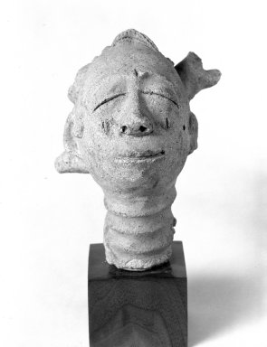 Anyi. <em>Funerary Head (Mma)</em>, 18th–19th century. Terracotta, 6 1/8 in. (15.5 cm). Brooklyn Museum, Gift of Dr. and Mrs. Abbott A. Lippman, 69.56. Creative Commons-BY (Photo: Brooklyn Museum, 69.56_bw.jpg)