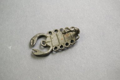 Akan. <em>Gold-weight (abrammuo): scorpion</em>, late 19th-early 20th century. Silver, 2 1/4 in. (5.7 cm). Brooklyn Museum, Gift of Jerome Furman, 70.106.6. Creative Commons-BY (Photo: Brooklyn Museum, 70.106.6_front_PS5.jpg)