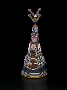 Yorùbá. <em>Beaded Crown (Ade) of Onijagbo Obasoro Alowolodu, Ogoga of Ikere 1890-1928</em>, late 19th or early 20th century. Glass beads, cloth, basketry, 22 3/4 × 9 1/4 × 9 7/16 in. (57.8 × 23.5 × 24 cm). Brooklyn Museum, Caroline A.L. Pratt Fund, Frederick Loeser Fund, and Carll H. de Silver Fund, 70.109.2. Creative Commons-BY (Photo: Brooklyn Museum, 70.109.2_view1_PS2.jpg)