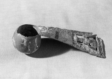 Chimú. <em>Paint Pot with Long Handle</em>. Copper, Length: 6 in. (15.2 cm). Brooklyn Museum, Gift of Ernest Erickson, 70.177.30. Creative Commons-BY (Photo: Brooklyn Museum, 70.177.30_acetate_bw.jpg)