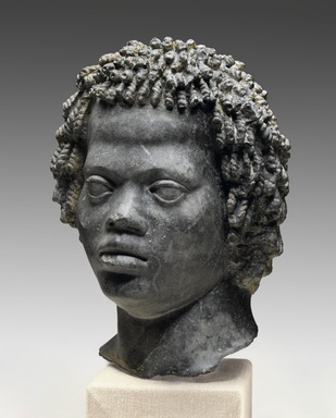 Ancient Near Eastern. <em>Head of a Man with Tight, Curly Hair</em>, late 2nd century B.C.E. Marble, "Bigio Morata", 11 x 7 11/16 x 7 1/2 in. (28 x 19.5 x 19 cm). Brooklyn Museum, Charles Edwin Wilbour Fund, 70.59. Creative Commons-BY (Photo: Brooklyn Museum, 70.59_PS2.jpg)