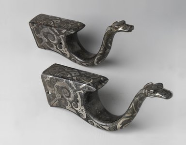 <em>Pair of Crossbow Mounts</em>, 770-256 B.C.E. Bronze, inlaid with silver, 7 3/4 x 3 1/4 in. (19.7 x 8.3 cm). Brooklyn Museum, Gift of Mr. and Mrs. Alastair B. Martin, the Guennol Collection, 71.118.1a-b. Creative Commons-BY (Photo: Brooklyn Museum, 71.118.1a-b_PS4.jpg)