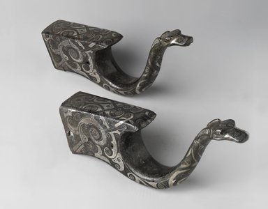  <em>Pair of Crossbow Mounts</em>, 770–256 B.C.E. Bronze, inlaid with silver, 7 3/4 x 3 1/4 in. (19.7 x 8.3 cm). Brooklyn Museum, Gift of Mr. and Mrs. Alastair B. Martin, the Guennol Collection, 71.118.1a-b. Creative Commons-BY (Photo: Brooklyn Museum, 71.118.1a-b_PS4.jpg)