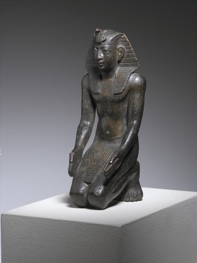  <em>Kneeling Statuette of King Necho</em>, ca. 610–595 B.C.E. Bronze, 5 1/2 x 2 1/4 x 2 3/4in. (14 x 5.7 x 7cm). Brooklyn Museum, Charles Edwin Wilbour Fund, 71.11. Creative Commons-BY (Photo: Brooklyn Museum, 71.11_threequarter_PS1.jpg)