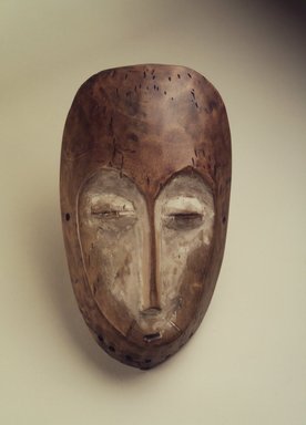 Lega. <em>Mask (Lukwakongo)</em>, 19th or 20th century. Wood, kaolin clay, 10 1/2 x 6 x 2 1/4 in. (26.7 x 15.2 x 5.7 cm). Brooklyn Museum, Gift of Nicholas A. de Kun, 71.173. Creative Commons-BY (Photo: Brooklyn Museum, 71.173.jpg)