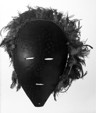 Lega. <em>Mask with Feathers (Lukungu)</em>, late 19th or early 20th century. Gourd, feathers, fiber cord, 10 1/4 x 8 x 2 1/2 in. (26.0 x 20.3 x 6.3 cm). Brooklyn Museum, Gift of Jerome Furman, 71.19.6. Creative Commons-BY (Photo: Brooklyn Museum, 71.19.6_bw.jpg)