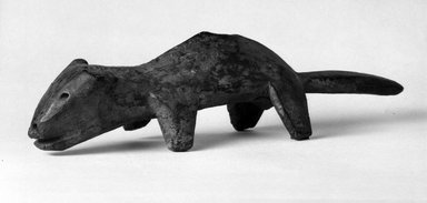 Lega. <em>Figure of an Animal (Mugugundu); Antelope (Lungaga) or Billy-goat (Kilimba)</em>, late 19th or early 20th century. Wood, patina, kaolin, 12 5/8 x 3 x 3 1/4 in. (32.0 x 7.6 x 8.2 cm). Brooklyn Museum, Gift of David R. Markin, 71.21.1. Creative Commons-BY (Photo: Brooklyn Museum, 71.21.1_bw.jpg)