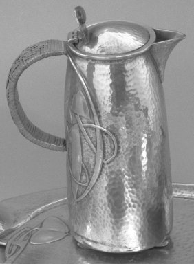 Liberty & Company (British, founded 1875). <em>Tea Service: Hot Water Jug</em>, ca. 1903. Hammered pewter, 8 3/4 x 3 in. (22.2 x 7.6 cm). Brooklyn Museum, Alfred T. and Caroline S. Zoebisch Fund, 71.71b. Creative Commons-BY (Photo: Brooklyn Museum, 71.71b_bw.jpg)