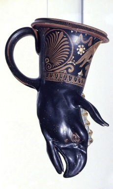Apulian. <em>Rhyton in Form of a Griffin's Head</em>, late 4rd century B.C.E. Clay, slip, 7 1/2 x 3 15/16 in. (19 x 10 cm). Brooklyn Museum, Gift of Mr. and Mrs. Thomas S. Brush, 71.79.181. Creative Commons-BY (Photo: Brooklyn Museum, 71.79.181_view1_slide.jpg)