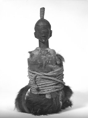 Tetela. <em>Power Figure (Nkishi)</em>, early 20th century. Wood, fur, hide, fiber, horn, 17 in.  (43.2 cm). Brooklyn Museum, Gift of Fernandez Arman to the Jennie Simpson Educational Collection of African Art, 72.102.4. Creative Commons-BY (Photo: Brooklyn Museum, 72.102.4_bw.jpg)