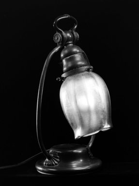 Tiffany Studios (1902–1932). <em>Lamp</em>, ca. 1900. Cast bronze, opalescent glass, Base: 11 13/16 x 6 1/4 x 5 1/8 in. (30 x 15.9 x 13 cm). Brooklyn Museum, Gift of Mrs. Frank Sanders, Jr., 72.15. Creative Commons-BY (Photo: Brooklyn Museum, 72.15_bw.jpg)