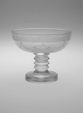 Steuben Glass, a division of Corning Glass Works, 1903-2011. <em>Champagne Glass, "St. Tropez,"  Part of Nine-Piece Setting</em>, ca.1933. Glass, 3 3/8 x 4 x 4 in. (8.6 x 10.2 x 10.2 cm). Brooklyn Museum, H. Randolph Lever Fund, 72.40.17. Creative Commons-BY (Photo: Brooklyn Museum, 72.40.17_bw_Justin_van_Soest_photograph.jpg)