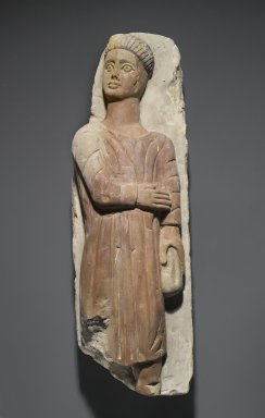  <em>Figure of a Man in High Relief</em>, 20th century. Limestone, pigment, 20 1/16 x 6 5/8 x 5 5/8 in. (51 x 16.8 x 14.3 cm). Brooklyn Museum, Gift of Mr. and Mrs. Harry Kahn, 72.9. Creative Commons-BY (Photo: Brooklyn Museum, 72.9_PS1.jpg)