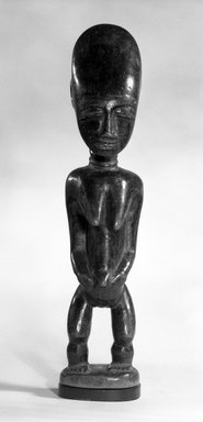 Kulango. <em>Standing Female Figure</em>, 20th century. Wood, 12 1/4 in.  (31.1 cm). Brooklyn Museum, Gift of Marcia and John A. Friede, 73.107.5. Creative Commons-BY (Photo: Brooklyn Museum, 73.107.5_bw.jpg)