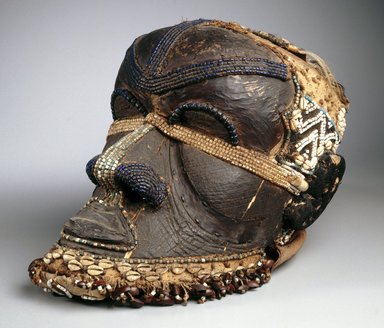 Kuba (Bushoong subgroup). <em>Bwoom Mask</em>, late 19th or early 20th century. Wood, copper alloy, skin, fur, plant fiber, textile, glass beads, cowrie shell, seedpods, pigments, 13 3/4 x 8 1/4 x 12 in. (35 x 21 x 30.5 cm). Brooklyn Museum, Gift of Mr. and Mrs. John McDonald, 73.178. Creative Commons-BY (Photo: Brooklyn Museum, 73.178_edited_version_SL1.jpg)