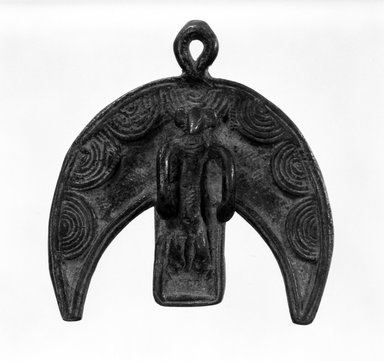 Nuna. <em>Crescent-shaped Form with Male Figure Prone at Center in Christ-like Position</em>, late 19th-early 20th century. Bronze, 3 1/4 x 3 1/2 in. (8.5 x 9.0 cm). Brooklyn Museum, Gift of Ruth R. Gross, 73.180.2. Creative Commons-BY (Photo: Brooklyn Museum, 73.180.2_bw.jpg)