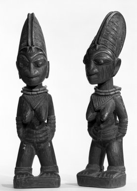 Yorùbá artist. <em>Female twin figure (Ère Ìbejì)</em>, late 19th or early 20th century. Beads, wood, pigment, 11 1/2in. (29.2cm). Brooklyn Museum, Gift of Ruth R. Gross, 73.180.7. Creative Commons-BY (Photo: , 73.180.6_73.180.7_bw.jpg)