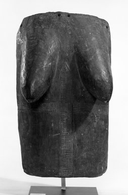 Yorùbá. <em>Female Torso Body Mask</em>, late 19th or early 20th century. Wood, applied surface materials, 18 1/2 x 11 x 6 3/4 in. Brooklyn Museum, Gift of Mr. and Mrs. John A. Friede, 74.121.1. Creative Commons-BY (Photo: Brooklyn Museum, 74.121.1_bw.jpg)
