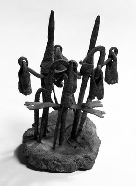 Dogon. <em>Head of Medicine Staff</em>, late 19th-early 20th century. Wood, iron, 6 1/2 x 5 1/4 x 4 1/4 in. (16.5 x 13.3 x 10.8 cm). Brooklyn Museum, Gift of Mr. and Mrs. Aaron Furman, 74.172.2. Creative Commons-BY (Photo: Brooklyn Museum, 74.172.2_bw.jpg)