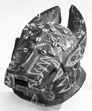 Baule. <em>Entertainment Mask</em>, late 19th-early 20th century. Wood, pigment, pitch, cowrie shells, metal, 10 x 21 x 12 3/4 in. (25.3 x 50.7 x 32.3 cm). Brooklyn Museum, Gift of Mr. and Mrs. John A. Friede, 74.212.2. Creative Commons-BY (Photo: Brooklyn Museum, 74.212.2_bw.jpg)