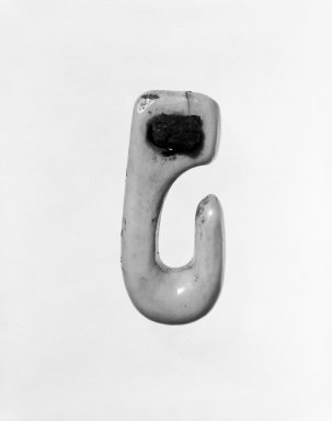Native Alaskan. <em>Hook-shaped Toggle</em>, late 19th-early 20th century. Ivory, wood, leather, 2 7/8 in. or (7.4 cm). Brooklyn Museum, Gift of Mr. and Mrs. John A. Friede, 74.212.4. Creative Commons-BY (Photo: Brooklyn Museum, 74.212.4_bw.jpg)