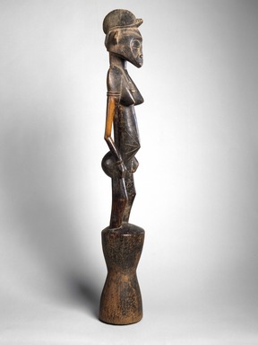 Senufo. <em>Rhythm Pounder (Siibele)</em>, late 19th or early 20th century. Wood, 40 1/2 x 6 x 6 1/2 in. (102.9 x 15.2 x 16.5 cm). Brooklyn Museum, Gift of Rosemary and George Lois, 74.214. Creative Commons-BY (Photo: Brooklyn Museum, 74.214_view02_edited_SL1.jpg)