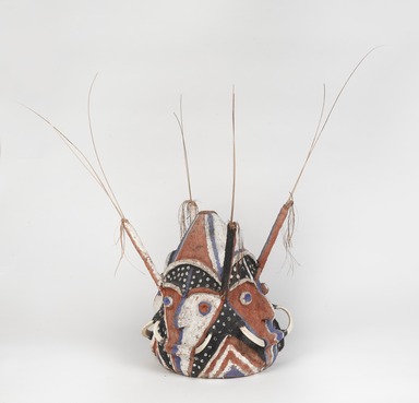 Tomman Islander. <em>Headdress (Nalowan Nambatin avi)</em>, mid 20th century. Tree fern, vegetal-fiber paste, tusks, pigment, 30 × 32 11/16 × 30 11/16 in. (76.2 × 83 × 78 cm) [measurements include fiber]. Brooklyn Museum, Gift of Mr. and Mrs. N. Richard Miller, 74.215.4. Creative Commons-BY (Photo: , 74.215.4_threequarter_PS9.jpg)