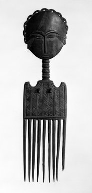 Asante. <em>Comb</em>, late 19th or early 20th century. Wood, 12 1/4 x 3 1/4 in. (31.1 x 8.3 cm). Brooklyn Museum, Gift of Dr. and Mrs. Willi Riese to the Jennie Simpson Educational Collection of African Art, 74.217.6. Creative Commons-BY (Photo: Brooklyn Museum, 74.217.6_bw.jpg)