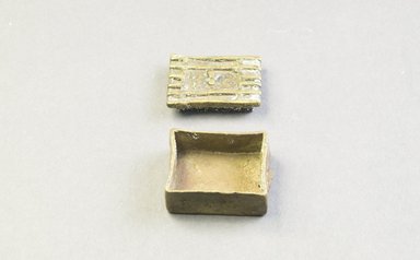 Asante. <em>Rectangular-Shaped Box with Lid</em>. Cast brass, 5/8 x 1 1/4 x 15/16 in. (1.6 x 3.2 x 2.4 cm). Brooklyn Museum, The Franklin H. Williams Collection of Ashanti Brass Weights and Accessory Objects for Weighing Gold, Gift of Mr. and Mrs. Franklin H. Williams, 74.218.113a-b. Creative Commons-BY (Photo: Brooklyn Museum, 74.218.113a-b_view2_PS5.jpg)