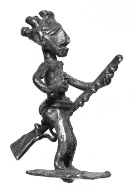 Asante. <em>Gold-weight (abrammuo): male figure</em>, 19th century. Cast brass, 1 3/4 x 1 1/2 in. (4.4 x 3.8 cm). Brooklyn Museum, The Franklin H. Williams Collection of Ashanti Brass Weights and Accessory Objects for Weighing Gold, Gift of Mr. and Mrs. Franklin H. Williams, 74.218.62. Creative Commons-BY (Photo: Brooklyn Museum, 74.218.62_bw.jpg)