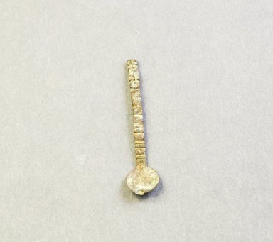 Asante. <em>Spoon</em>. Brass, 7/16 x 2 in. (1.1 x 5.1 cm). Brooklyn Museum, The Franklin H. Williams Collection of Ashanti Brass Weights and Accessory Objects for Weighing Gold, Gift of Mr. and Mrs. Franklin H. Williams, 74.218.6. Creative Commons-BY (Photo: Brooklyn Museum, 74.218.6_front_PS5.jpg)