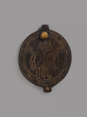  <em>Lid of Circular Cosmetic Container with Birth God</em>, ca. 1479–1400 B.C.E. Wood, ivory, paste (?), 3 1/8 x 2 1/2 x 3/16 in. (7.9 x 6.3 x 0.5 cm). Brooklyn Museum, Charles Edwin Wilbour Fund, 74.45. Creative Commons-BY (Photo: Brooklyn Museum, 74.45_PS9.jpg)