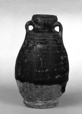  <em>Bottle</em>, 15th century. Sawankhalok brown-glazed earthenware, 4 3/4 x 2 3/4 in. (12.1 x 7 cm). Brooklyn Museum, By exchange, 74.59.5. Creative Commons-BY (Photo: Brooklyn Museum, 74.59.5_bw.jpg)