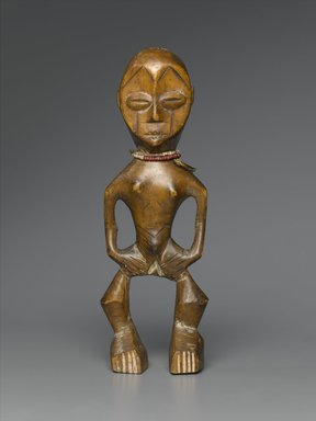 Lega. <em>Figure (Iginga)</em>, late 19th or early 20th century. Wood, plastic beads, 11 x 3 3/4 x 2 1/2 in. (27.9 x 9.5 x 6.4 cm). Brooklyn Museum, Gift of Marcia and John Friede, 74.66.1. Creative Commons-BY (Photo: Brooklyn Museum, 74.66.1_PS2.jpg)