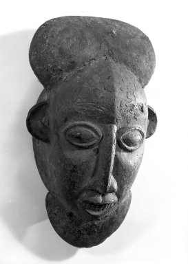 Kom. <em>Mask</em>, late 19th or early 20th century. Wood, hair, accumulated/applied materials, 17 x 9 1/2 x 5 3/4 in. (43.2 x 24.2 x 14.6 cm). Brooklyn Museum, Gift of Mr. and Mrs. John A. Friede, 74.66.3. Creative Commons-BY (Photo: Brooklyn Museum, 74.66.3_bw.jpg)