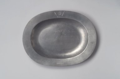 Jay Thomas Stauffer (after original by Henry Will). <em>Platter, After Henry Will</em>, 1974 (after original of 1761–1793). Pewter, 1 1/4 x 15 1/4 x 11 5/8 in. (3.2 x 38.7 x 29.5 cm). Brooklyn Museum, Gift of Jay Thomas Stauffer, 74.77. Creative Commons-BY (Photo: Brooklyn Museum, 74.77.jpg)