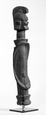 Wurkun. <em>Figure (Wumdul)</em>, early 20th century. Wood, pigment, 19 1/4 x 3 1/2 x 4 in. (48.4 x 9.0 x 10.3 cm). Brooklyn Museum, Gift of Marcia and John Friede, 75.151.4. Creative Commons-BY (Photo: Brooklyn Museum, 75.151.4_bw.jpg)