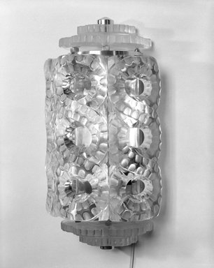 Rene J. Lalique (1860-1945). <em>One of a Pair of Sconce</em>, ca. 1930. Glass, chromium, 14 1/2 x 7 1/4 x 5 in. (36.8 x 18.4 x 12.7 cm). Brooklyn Museum, Gift of Mrs. MacDonald Mathey, 75.22.1a-h. Creative Commons-BY (Photo: Brooklyn Museum, 75.22.1a-h_bw.jpg)
