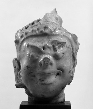  <em>Sawankhalok Gleazed Head of a Deva</em>, 14th century. Stoneware, 3 5/8 x 2 1/4 in. (9.2 x 5.7 cm). Brooklyn Museum, Designated Purchase Fund, 75.62.5. Creative Commons-BY (Photo: Brooklyn Museum, 75.62.5_bw.jpg)
