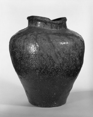  <em>Storage Jar, Tamba Ware</em>, 16th-17th century. Stoneware with ash glaze, kiln scars and blisters; Echizen or Tokoname ware, height: approx. 11 in.  (27.9 cm). Brooklyn Museum, Gift of Amy and Robert L. Poster, 76.185.1. Creative Commons-BY (Photo: Brooklyn Museum, 76.185.1_bw.jpg)
