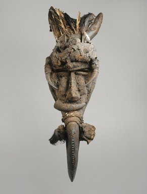 Mau. <em>Koma Ba Mask</em>, late 19th-early 20th century. Wood, cowrie shells, metal, feathers, horns, leather, fiber, sacrificial materials, 41 x 11 x 11 in. (104.1 x 27.9 x 27.9 cm). Brooklyn Museum, Gift of Marcia and John Friede, 76.20.2. Creative Commons-BY (Photo: Brooklyn Museum, 76.20.2_SL1.jpg)