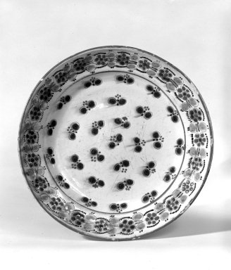  <em>Dish</em>, 19th century (possibly). Earthenware, 10 15/16 in. (27.8 cm). Brooklyn Museum, The C. Helme and Alice B. Strater Collection, Gift of C. Helme Strater, Jr., John B. Strater, and Margaret S. Robinson, 76.34.4. Creative Commons-BY (Photo: Brooklyn Museum, 76.34.4_bw.jpg)