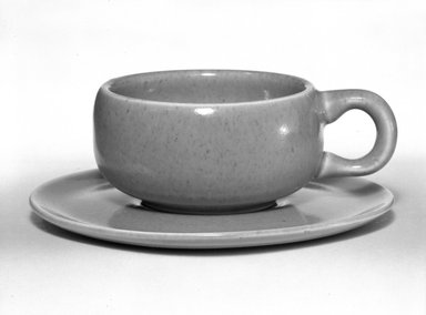 Russel Wright (American, 1904-1976). <em>Cup and Saucer, American Modern Pattern</em>, Designed 1937; Manufactured ca. 1938. Earthenware, 1 3/8 in. (3.5 cm) cup. Brooklyn Museum, Gift of Russel Wright, 76.99.22a-b. Creative Commons-BY (Photo: Brooklyn Museum, 76.99.22a-b_bw.jpg)