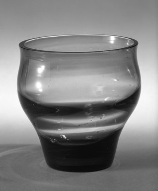 Russel Wright (American, 1904–1976). <em>Glass</em>, 1940s. Amber glass, 3 15/16 x 3 5/8 in. (10 x 9.2 cm). Brooklyn Museum, Gift of Russel Wright, 76.99.8. Creative Commons-BY (Photo: Brooklyn Museum, 76.99.8_bw.jpg)