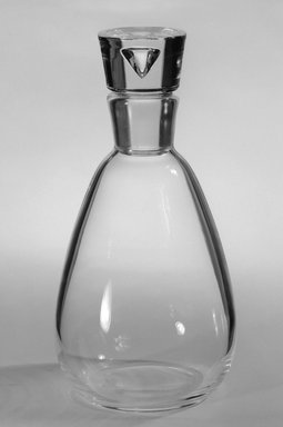 Steuben Glass, a division of Corning Glass Works, 1903-2011. <em>Decanter and Stopper</em>, ca. 1940. Glass, 9 1/8 x 4 1/4 x 4 1/4 in. (23.2 x 10.8 x 10.8 cm). Brooklyn Museum, Gift of Mrs. Bernard Schiro, 77.190.1a-b. Creative Commons-BY (Photo: Brooklyn Museum, 77.190.1_bw.jpg)