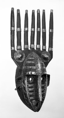 Marka. <em>N'Tomo Mask</em>, late 19th-early 20th century. Wood with applied white metal and copper alloy decoration, 20 3/4 x 9 x 6 1/4 in. (52.7 x 22.9 x 15.9cm). Brooklyn Museum, Gift of Mr. and Mrs. John A. Friede, 77.243.1. Creative Commons-BY (Photo: Brooklyn Museum, 77.243.1_bw.jpg)