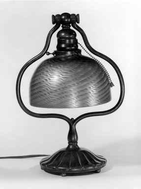 Tiffany Studios (1902-1932). <em>Lamp</em>, 1905-1938. Bronze, opalescent glass, Lamp: 13 1/2 x 5 5/8 in. (34.3 x 14.3 cm). Brooklyn Museum, Bequest of Carl Otto von Kienbusch, 77.86.5. Creative Commons-BY (Photo: Brooklyn Museum, 77.86.5_bw.jpg)