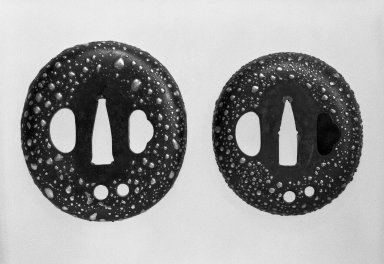 <em>Pair of Sword Guards</em>, 19th century. Iron, silver, .A: 3 1/8 x 2 3/4 in. (8 x 7 cm). Brooklyn Museum, Gift of Mr. and Mrs. Arthur Wiesenberger, 77.98a-b. Creative Commons-BY (Photo: Brooklyn Museum, 77.98a-b_bw.jpg)