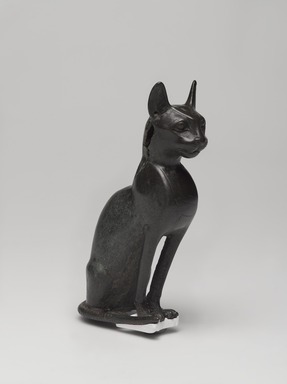  <em>Cat (Bastet)</em>, 664-343 B.C.E. Bronze, 5 1/4 x 1 5/8 x 3 3/4 in. (13.3 x 4.1 x 9.5 cm). Brooklyn Museum, Gift of Mrs. Nasli Heeramaneck, 78.243. Creative Commons-BY (Photo: , 78.243_threequarter_PS9.jpg)